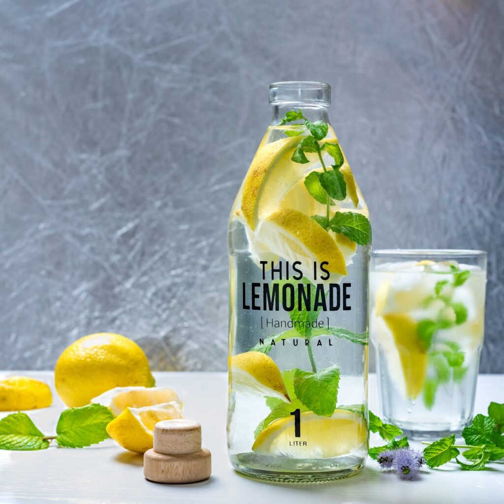 photo of bottle beside glass